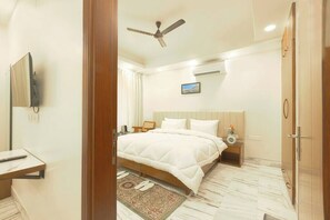 A cozy bedroom scene with a cup of tea on a bedside table, offering a warm and comforting atmosphere.