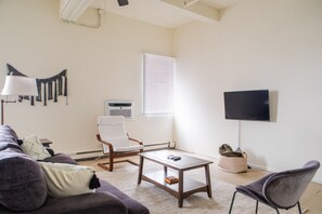 Spacious living room with city skyline views