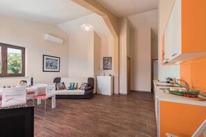 Living room (kitchen, sofa, dining table)