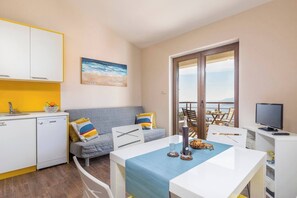 Living room (kitchen, sofa, dining table)
