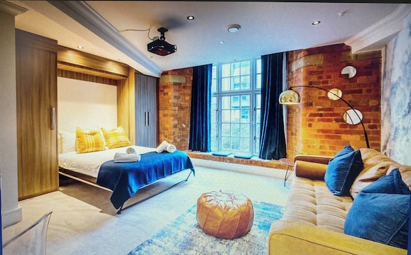  Fabulous living area with ceiling projector for movie nights and chilling.