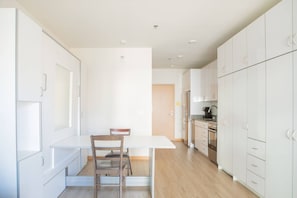 Murphy bed folded up into dining table/workspace