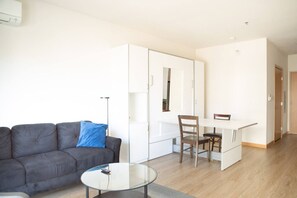 Murphy bed folded up into dining table/workspace