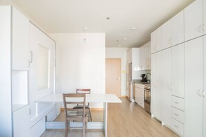 Murphy bed folded up into dining table/workspace