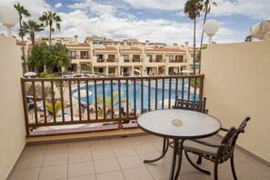 Balcony access blending indoor comfort with outdoor freshness.
