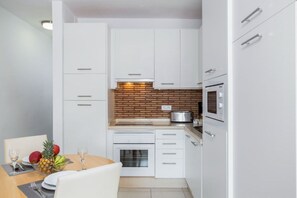 Prepare your favorite meals in our sleek kitchen.