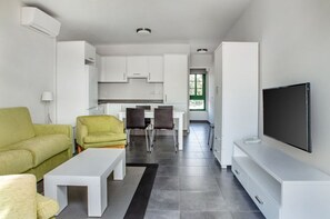 Step into a sleek, fully-equipped kitchen to whip up delectable meals with ease.