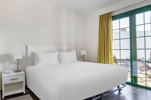 Slumber in serenity in a bedroom adorned with soft, inviting hues and plush bedding.