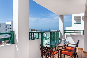 An outdoor balcony area with seating, good for a breath of fresh air or a quick break.