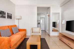 A practical living area with seating and space for everyday activities.