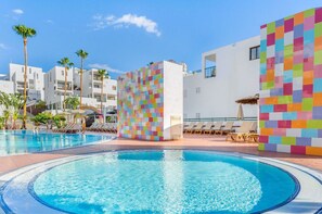 Poolside serenity meets playful design, creating a unique and engaging environment.