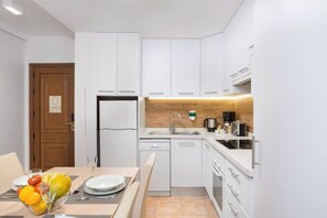 Well-appointed kitchen space featuring modern appliances and a sleek design.