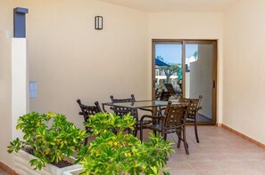 Sunlit living room opening onto a welcoming balcony, perfect for morning coffees and evening wines.