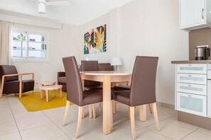 Inviting dining space with ample seating, perfect for family meals or entertaining guests.