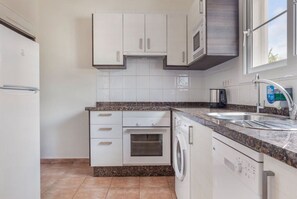 Modern, fully-equipped kitchen, perfect for crafting your favorite meals.