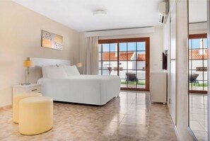 Spacious and inviting lounge with ample seating for relaxation or socializing.