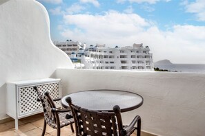 Private balcony with seating, offering a secluded spot to enjoy the panoramic views.