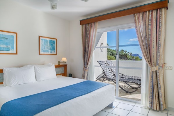 Inviting bedroom  where morning views and fresh air await.
