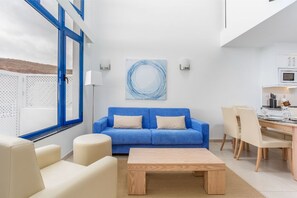 Lounge in style in our chic living space with touches of ocean blue.