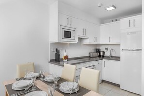 Dine in elegance in our minimalist kitchen and dining area.
