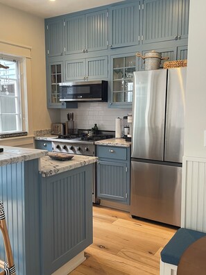 Kitchen with new refrigerator & icemaker