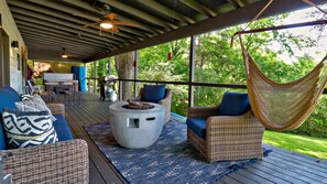40 ft Covered Deck with seating area, gas firepit, table, grill & hot tub 