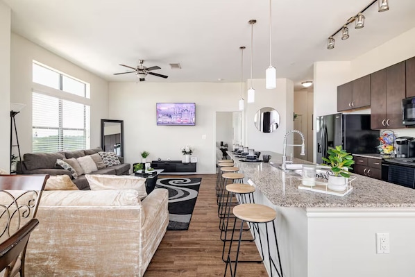Open Layout Family Room With Spacious Island Top
