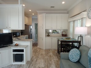 The high ceilings and big windows make this tiny home feel expansive.