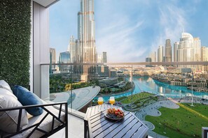 Enjoy unbeatable views of the Burj Khalifa, Dubai Mall & the Fountain shows from the balcony. Furnished with a triple seater sofa and an individual chair, there is plenty of room for everyone to enjoy.
