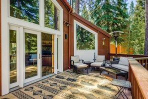 Exterior: Deck with outdoor seating and grill