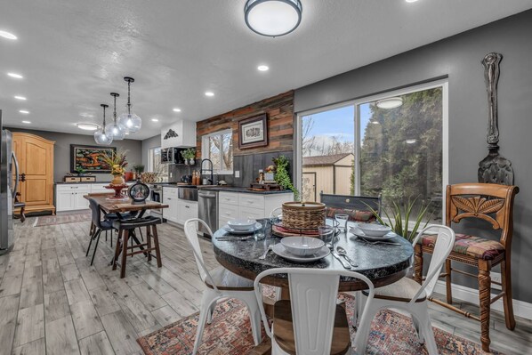 Breakfast Nook with a view of the Backyard and Center Bar in the Kitchen for those Quick meals Between Adventures