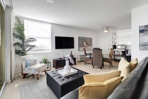 The wall-mounted Smart TV has community provided cable programming.