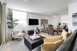 The wall-mounted Smart TV has community provided cable programming.
