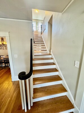 Our unique stairway splits off into access to either our living room or our playroom.