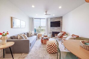 The living area, exquisitely furnished with elegant modern boho décor
