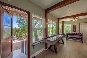 Game Room with a pool table, foosball and shuffleboard!