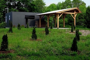 Front of Tradstuga with white oak and white pine post and beam car port