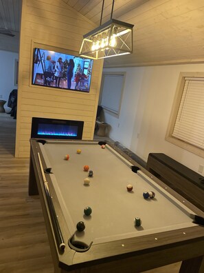 Pool table that converts to a table with benches for family meals/games. 