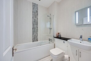 Bathroom with complimentary toiletries provided.