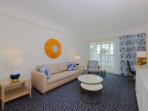 Bright and inviting living area with modern coastal decor, offering a warm and stylish retreat.