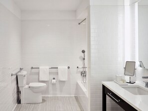 Modern bathroom with a clean, functional layout, offering a relaxing and accommodating space.