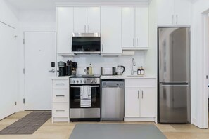 Fully equipped kitchen with silver appliances 