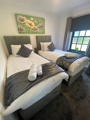 Two Pocket Sprung Beds Draped in Luxury Egyptian Cotton Bedding