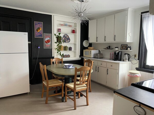 Extendable Kitchen table to accommodate larger groups with extra chairs included