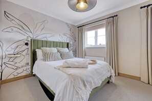 Spacious double, blackout blinds, bedside sockets, quality linen, soundproofing.