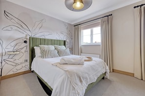 Spacious double, blackout blinds, bedside sockets, quality linen, soundproofing.