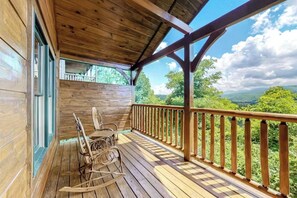 Relax in one of the classic wooden rocking chairs and take in the panoramic mountain views. The perfect spot for sunrise sips or sunset chats.