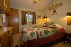 Spacious bedroom with queen bed and a large closet