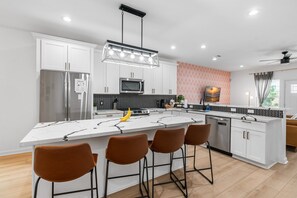 Fully equipped kitchen is a chef's dream, designed for both convenience & style.