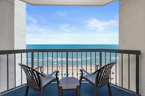 Private balcony with seating to enjoy fresh ocean air.